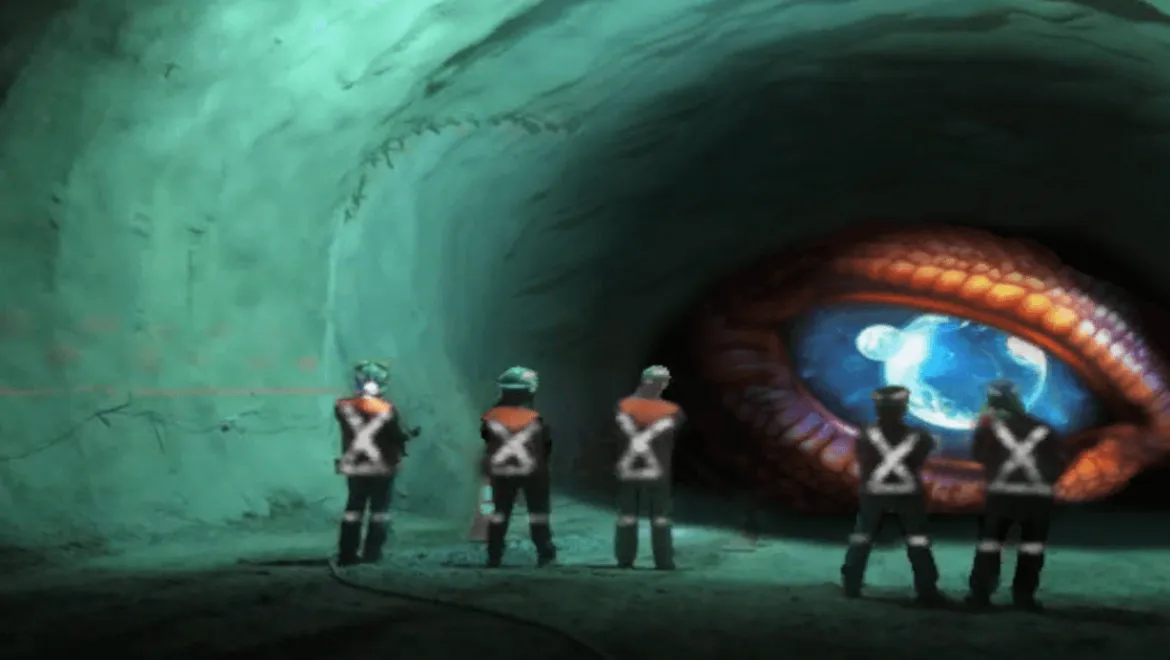 L'œil d'un dragon observant plusieurs personnes vêtues d'EPI dans un tunnel minier.