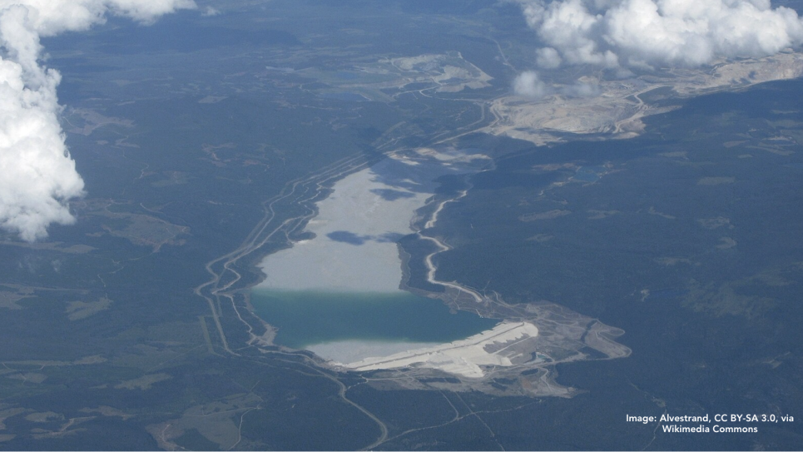 Aerial view of Highland Valley Copper Mine in British Columbia, showing the open-pit mine area, surrounding landscape, and a large tailings dam/storage facility. Image: Alvestrand, CC BY-SA 3.0, via Wikimedia Commons