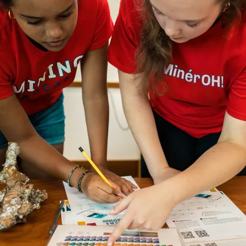 Students exploring the periodic table and the elements needed to build a smart phone.