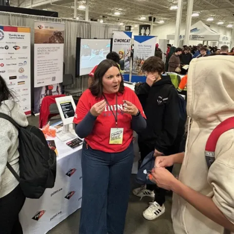 Students engaging with career educators at the Mining Matters/PDAC interactive exhibit