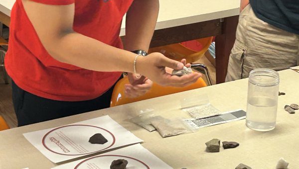Instructor explaining how some rocks float and some rocks sink.